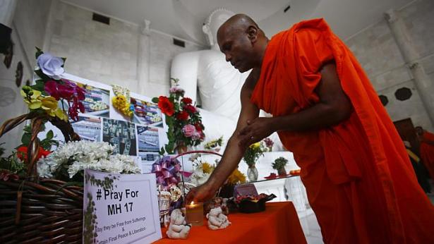 Malaysia Airlines MH17 crash: More than 100 attend memorial for victims at Kuala Lumpur Buddhist temple